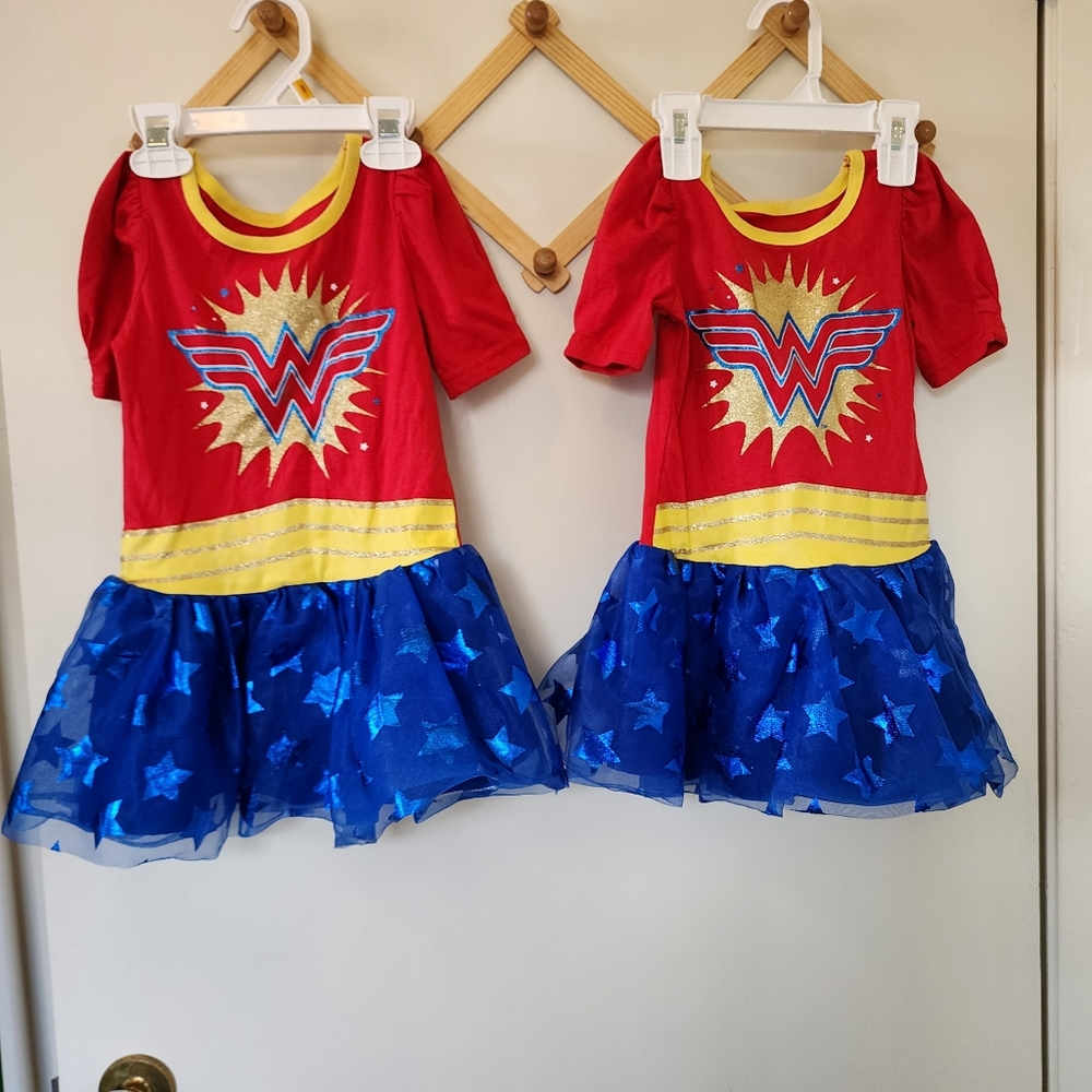 2 Wonder Woman 2T dresses missing cape Used good condition.